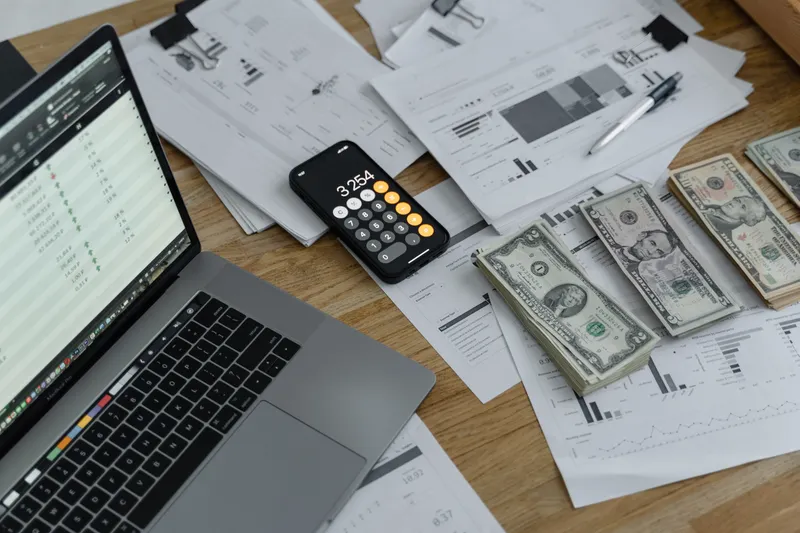 Freelancer organizing tax receipts and expense records on a desk